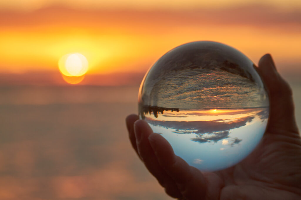 The sun sets over Lake Constance in Germany and lit by a crystal ball.